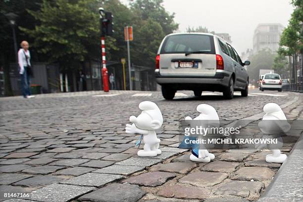 Photo shows white 'Smurfs' in the streets of Liege, to celebrate the 50th anniversary of Peyo 's Smurfs, on June 6, 2008 in Liege. People can take a...