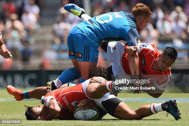 Fumiaki Tanaka of the Sunwolves is tackled during the Super Rugby match between the Sunwolves and the Blues at Prince Chichibu Stadium on July 15,...