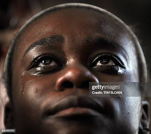 Young girl cries while listening to a speech by US Democraticpresidential candidate, Illinois Senator Barack Obama during a rally to officially kick...