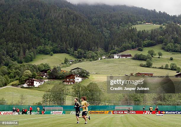 Carles Puyol of Spain runs with his teammate Andres Iniesta during a Spain training session, ahead of the Euro 2008 championships, June 6, 2008 in...