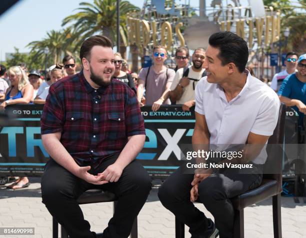 John Bradley and Mario Lopez visit "Extra" at Universal Studios Hollywood on July 14, 2017 in Universal City, California.