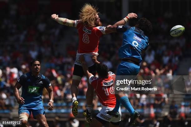 Willie Britz of the Sunwolves competes for the ball against Steven Luatua of the Blues during the Super Rugby match between the Sunwolves and the...