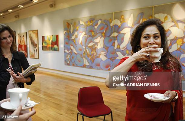 Tina Ambani , founder and patron of Harmony Art Foundation drinks a cup of tea while discussing art at Christie's auction house, in London, on June...