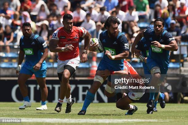 Steven Luatua of the Blues is tackled during the Super Rugby match between the Sunwolves and the Blues at Prince Chichibu Stadium on July 15, 2017 in...