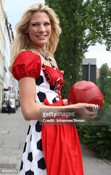 Sarah Brandner, girlfriend of German national player Bastian Schweinsteiger, presents the football euro-dirndl at Trachtenmoden Angermaier on June 6,...