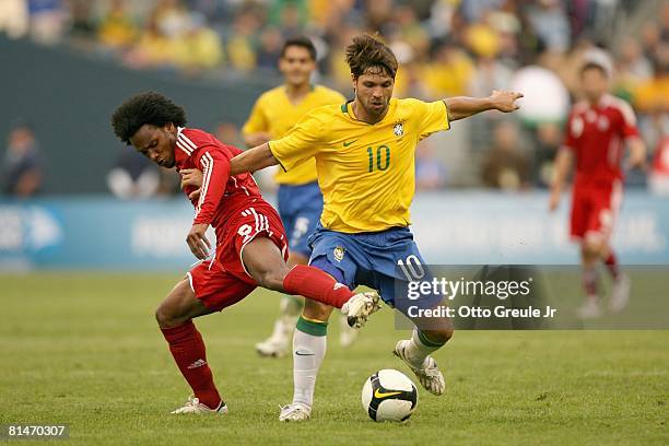 Diego of Brazil moves for the ball against Julian De Guzman of Canada on May 31, 2008 at Qwest Field in Seattle, Washington. Brazil defeated Canada...