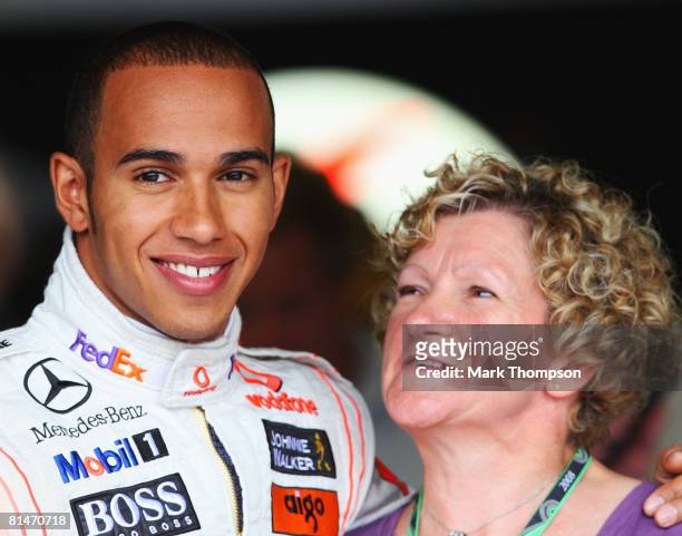 Lewis Hamilton of Great Britain and McLaren Mercedes is seen in his team garage with his mother Carmen Lockhart during practice for the Canadian...
