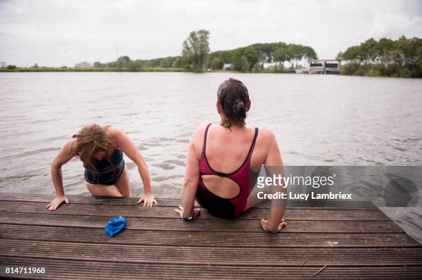 Mature women swimming in open water