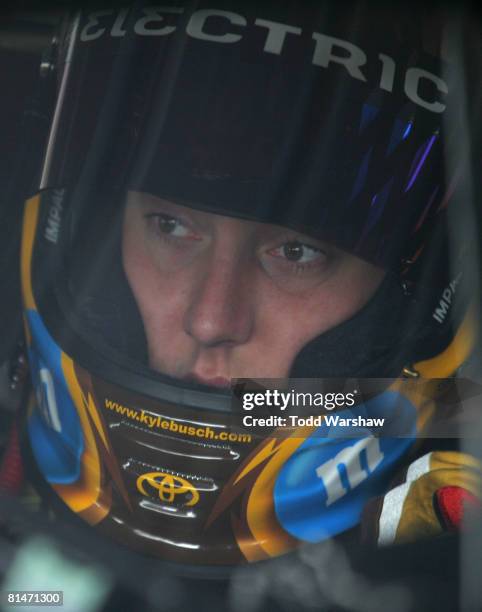 Kyle Busch, driver of the M&M's Toyota, waits in his car during practice for the NASCAR Sprint Cup Series Pocono 500 on June 6, 2008 at Pocono...