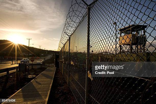 The sun rises over Camp Delta detention compound which has housed foreign prisoners since 2002, at Guantanamo Bay U.S. Naval Base, June 6, 2008 in...