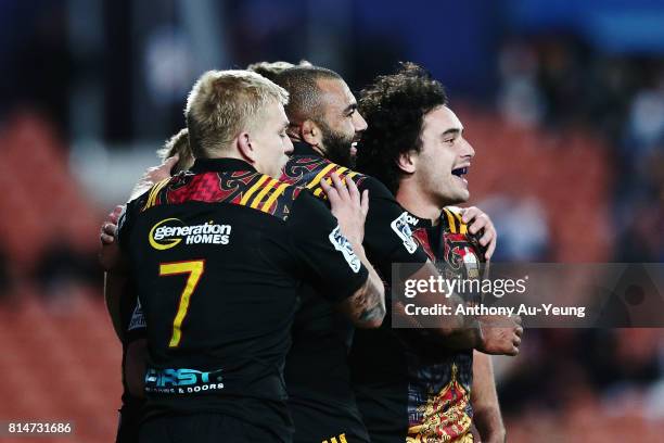 James Lowe of the Chiefs celebrates with teammates after scoring a try later ruled disallowed during the round 17 Super Rugby match between the...