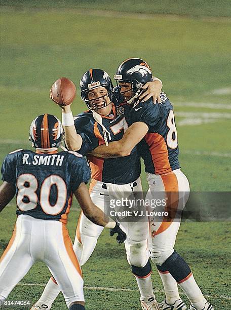 Football: Super Bowl XXXII, Denver Broncos QB John Elway victorious with Ed McCaffrey and Rod Smith after winning game vs Green Bay Packers, San...