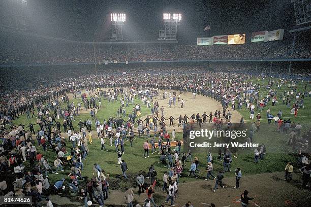 Baseball: World Series, Detroit Tigers fans victorious on View of Tiger Stadium field after game vs San Diego Padres, Detroit, MI