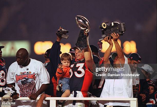 Football: Super Bowl XXXII, Denver Broncos Bill Romanowski victorious with son and Vince Lombardi trophy after winning game vs Green Bay Packers, San...