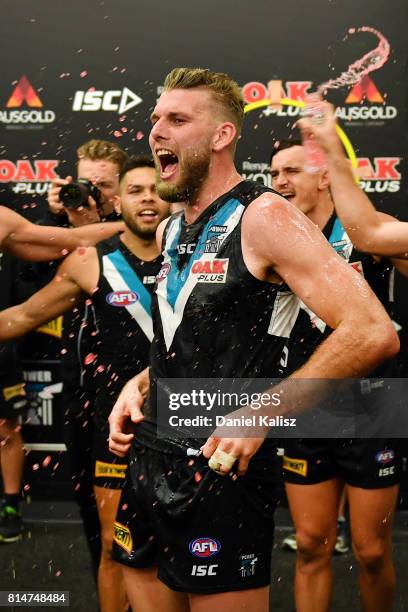 Jackson Trengove of the Power sings the club song after the round 17 AFL match between the Port Adelaide Power and the North Melbourne Kangaroos at...