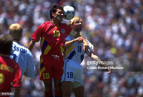 Soccer: World Cup, SWE Hakan Mild in action during head ball vs ROM Gheorghe Hagi , Stanford, CA 7/10/1994