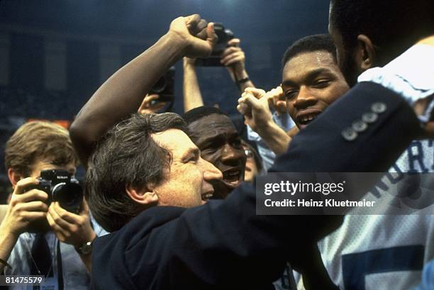 College Basketball: NCAA Final Four, Closeup of North Carolina coach Dean Smith victorious with James Worthy , Sam Perkins , and Michael Jordan after...