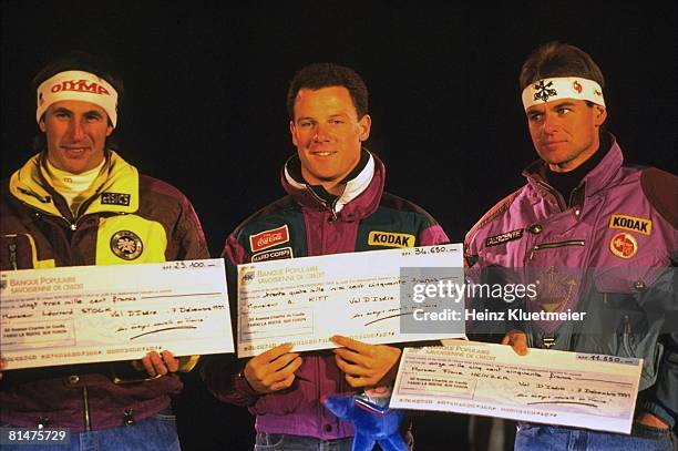 Skiing: World Cup, Closeup of AUT Leonard Stock, USA A,J, Kitt, and CHE Franz Heinzer victorious with prize check after winning event, Val d'Isere,...