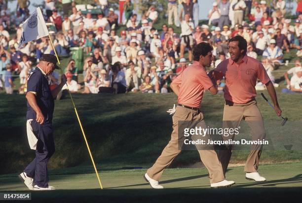 Golf: Ryder Cup, Europe Jose Maria Olazabal and Seve Ballesteros after making shot on No, 14 during Saturday play at Muirfield Village GC, Dublin, OH...