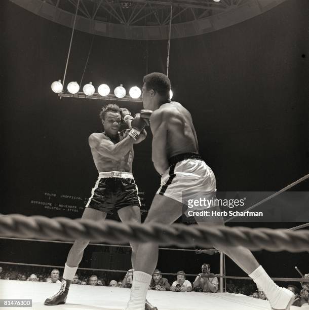 Boxing: World Heavyweight Title, Cleveland Williams in action, taking punch vs Muhammad Ali at Astrodome, Houston, TX