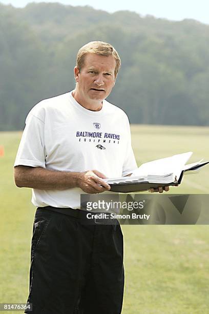 Football: Portrait of Baltimore Ravens coach Jim Fassel holding playbook during mini camp, Baltimore, MD 6/14/2005