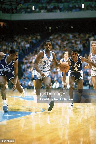 College Basketball: North Carolina Kenny Smith in action vs Duke Johnny Dawkins and Tommy Amaker , Chapel Hill, NC 1/18/1986