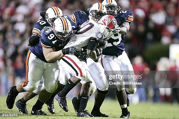 Coll, Football: Auburn Josh Thompson with team in action, making tackle vs Georgia Thomas Brown , Auburn, AL