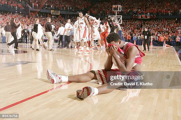 College Basketball: NCAA Playoffs, Arizona Jawann McClellan upset, sitting on court floor as Illinois Dee Brown and team victorious after overtime...