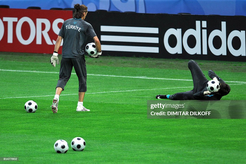 Turkish goalkeepers Rustu Recber (L) and