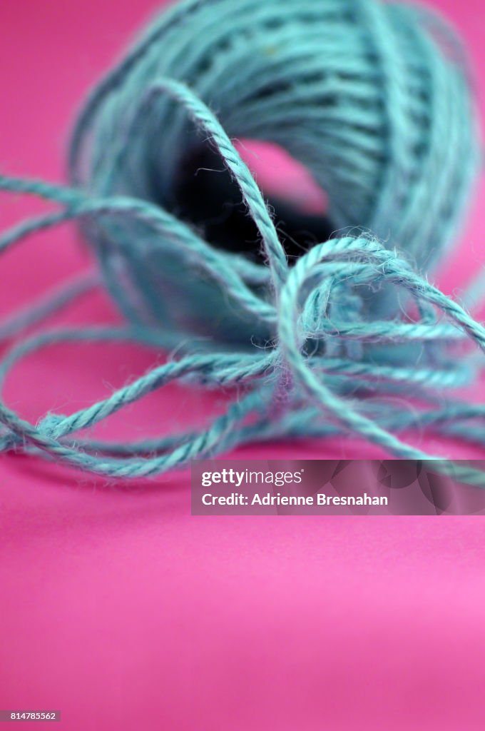 Blue Ball of Twine, Defocused, on Hot Pink Background