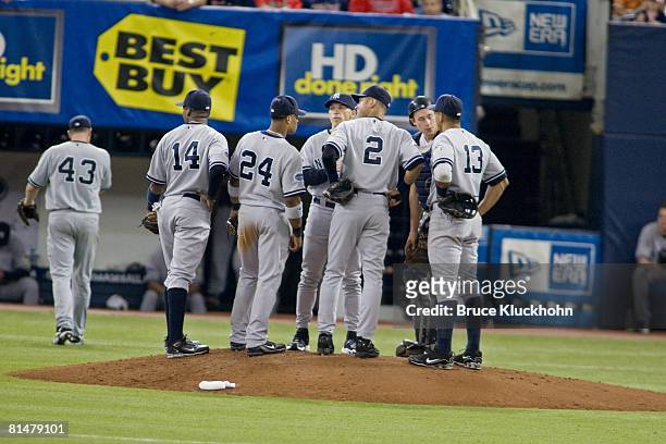 Wilson Betemit , Robinson Cano , Joe Girardi, Derek Jeter , Chad Moeller , and Alex Rodriguez of the New York Yankees meet at the mound during a...