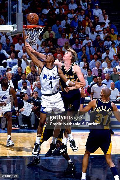 Anfernee "Penny" Hardaway of the Orlando Magic shoots a layup against Rick Smits of the Indiana Pacers in Game One of the Eastern Conference...