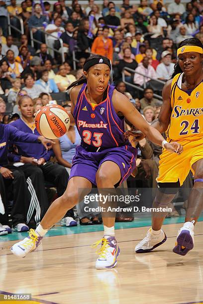 Cappie Pondexter of the Phoenix Mercury drives the baseline against Marie Ferdinand-Harris of the Los Angeles Sparks on June 6, 2008 at Staples...