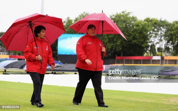 Umpires Kathy Cross and Sue Redfern inspect the outfield, as rain delays the start of play ahead of the ICC Women's World Cup 2017 match between...
