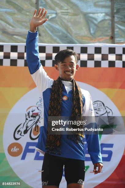 Blue jersey winner Muh. Imam Arifin of KFC Cycling Team Indonesia celebrates on the podium during Stage 2 of Tour de Flores 2017, Maumere-Ende 142.8...