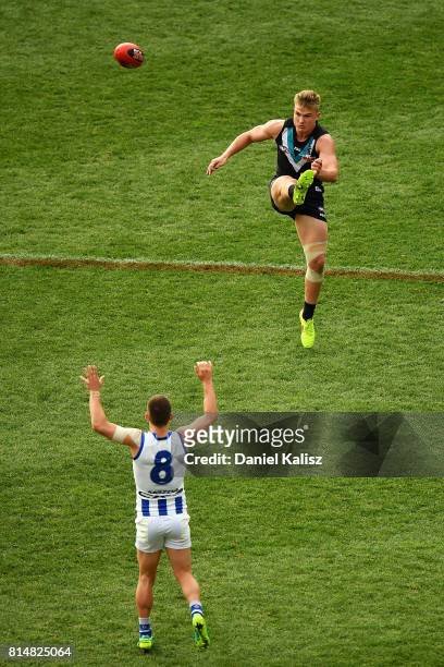Ollie Wines of the Power kicks the ball during the round 17 AFL match between the Port Adelaide Power and the North Melbourne Kangaroos at Adelaide...