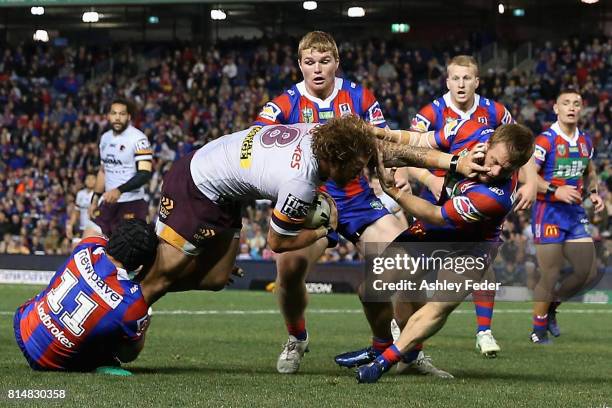 Korbin Sims of the Broncos scores a try during the round 19 NRL match between the Newcastle Knights and the Brisbane Broncos at McDonald Jones...