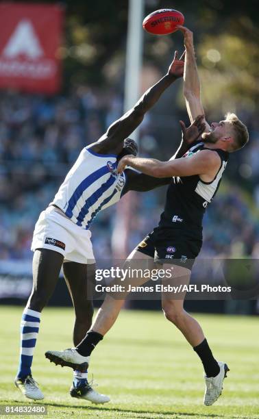 Majak Daw of the Kangaroos competes with Jackson Trengove of the Power during the 2017 AFL round 17 match between the Port Adelaide Power and the...