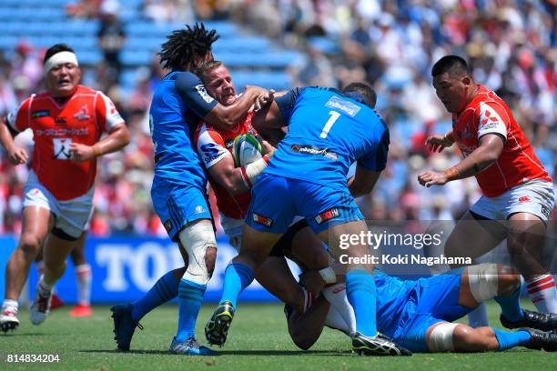 Riaan Viljoen of Sunwolves is tackled during the Super Rugby match between the Sunwolves and the Blues at Prince Chichibu Stadium on July 15, 2017 in...