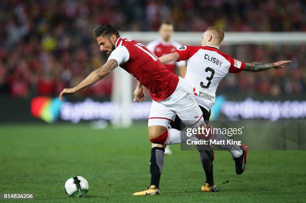 Olivier Giroud of Arsenal is challenged by Jack Clisby of the Wanderers during the match between the Western Sydney Wanderers and Arsenal FC at ANZ...