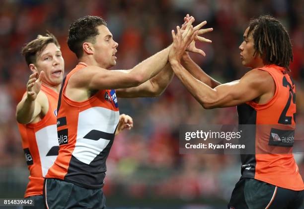 Josh Kelly of the Giants celebrates a goal with Tendai Mzungu of the Giants during the round 17 AFL match between the Greater Western Sydney Giants...