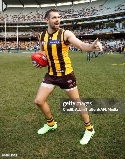 Luke Hodge of the Hawks comes onto the field for his 300th game during the 2017 AFL round 17 match between the Geelong Cats and the Hawthorn Hawks at...