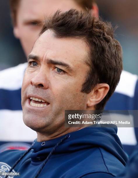 Chris Scott, Senior Coach of the Cats addresses his players during the 2017 AFL round 17 match between the Geelong Cats and the Hawthorn Hawks at the...