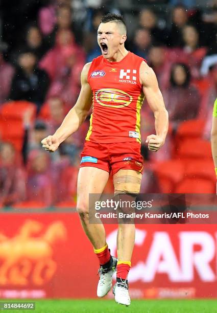 Ben Ainsworth of the Gold Coast Suns celebrates kicking a goal during the round 17 AFL match between the Gold Coast Suns and the Collingwood Magpies...