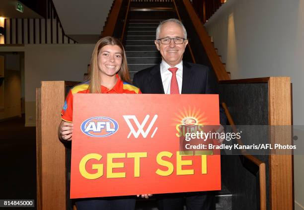 Prime Minister Malcolm Turnbull poses for a photo while taking a tour of the newly built facilities at the opening of the Suns Training and...