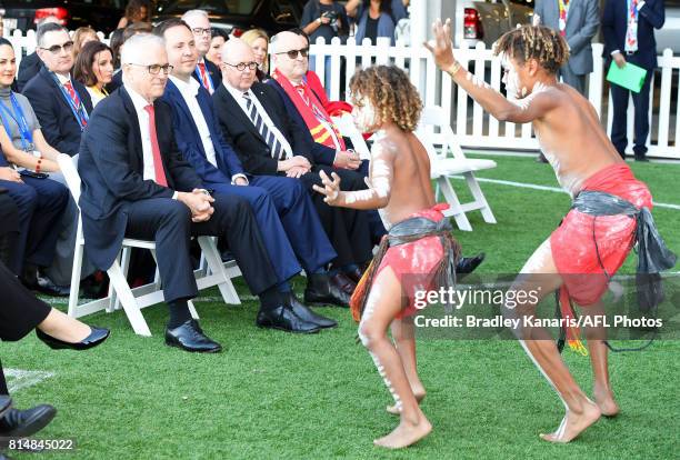 Prime Minister Malcolm Turnbull is seen enjoying watching a group of young indigenous traditional dancers at the opening of the Suns Training and...