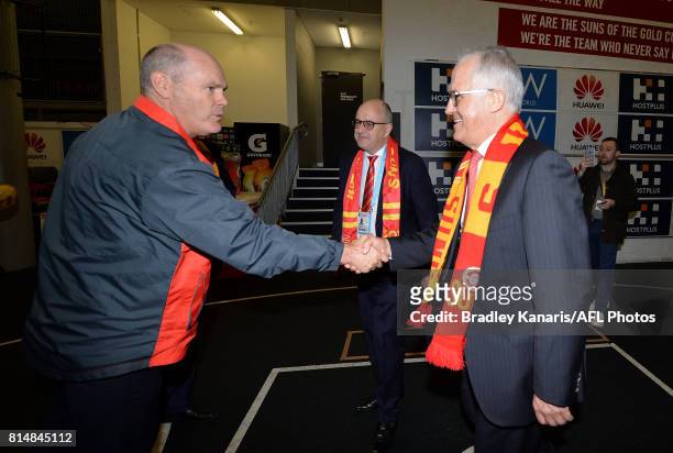 Prime Minister Malcolm Turnbull meets with Coach Rodney Eade of the Suns before the round 17 AFL match between the Gold Coast Suns and the...