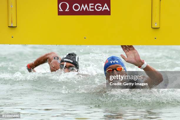 Marc-Antoine Olivier of France crosses the finish line to win the Men's 5km Open Water Swimming on day two of the Budapest 2017 FINA World...