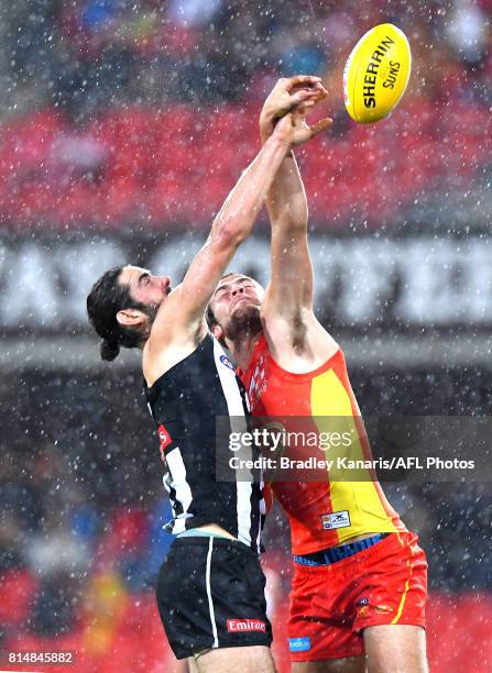 Brodie Grundy of the Collingwood Magpies and Jarred Witts of the Gold Coast Suns compete for the ball during the round 17 AFL match between the Gold...