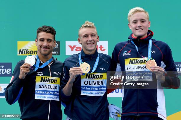 Mario Sanzullo of Italy, Marc-Antoine Olivier of France and Timothy Shuttleworth of Great Britain pose on the podium after the Men's 5km Open Water...